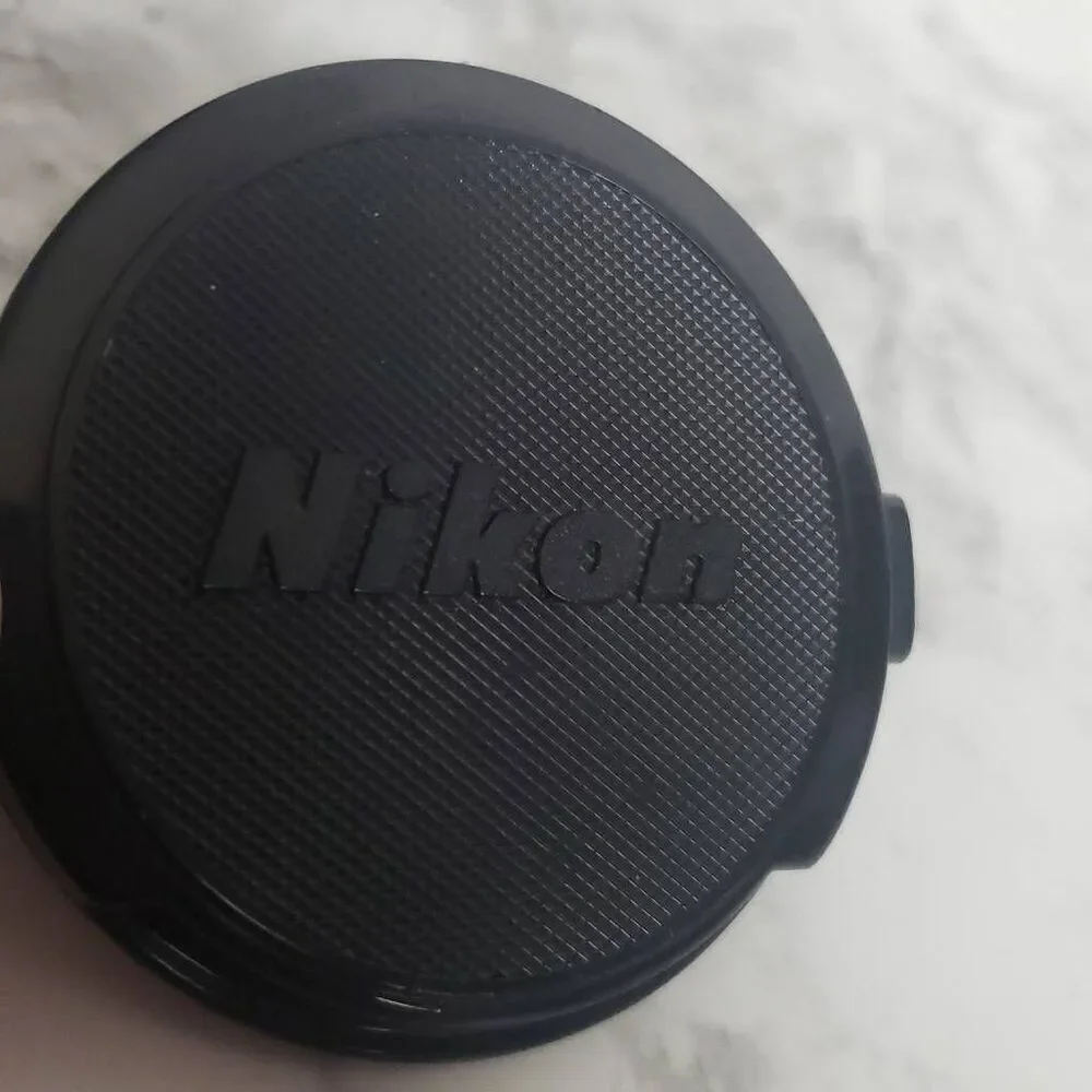 Nikon 52m.‎ Camera Cap